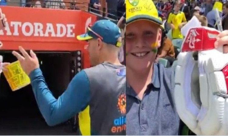 Warner wins hearts by gifting youngster his gloves Images