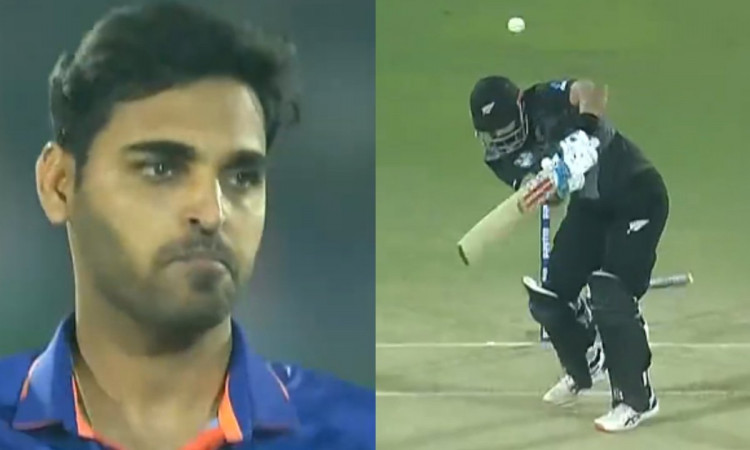 Bhuvneshwar Kumar makes a mess of the stumps as Daryl Mitchell walks back for a first ball