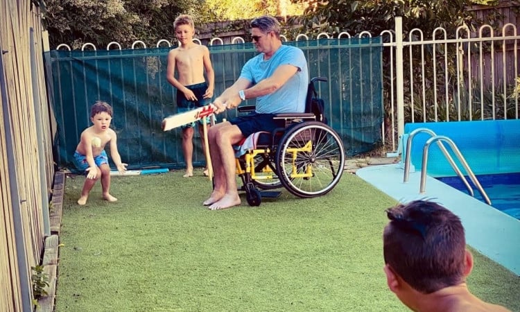 Chris Cairns progressing well; posts images of him playing cricket sitting in a wheel-chair