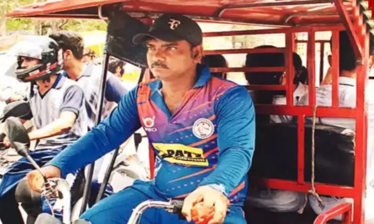 Cricket Image for disabled cricketer raja babu drives an e rickshaw