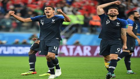 Defending champions France rally from a goal down to trounce Australia 4-1
