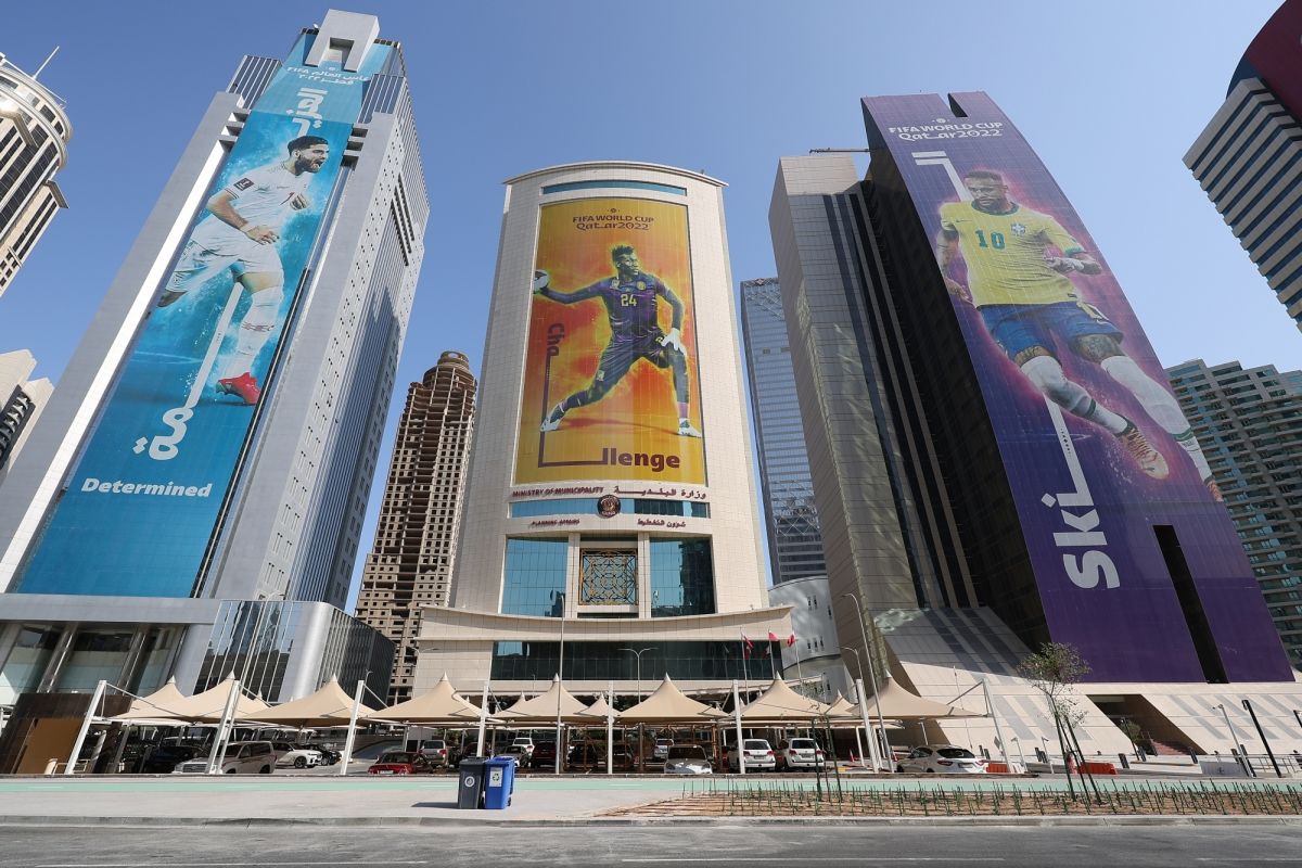 Doha:Giant photos of main players from each nation are hung on the outer walls of buildings in Doha,