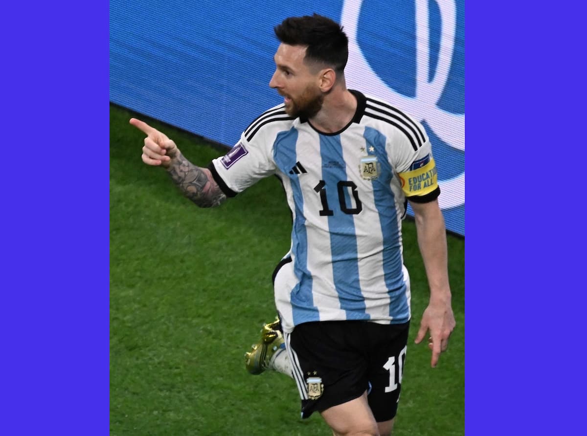 Doha:Argentina's Lionel Messi celebrates after scoring his team's first goal during the World Cup ro