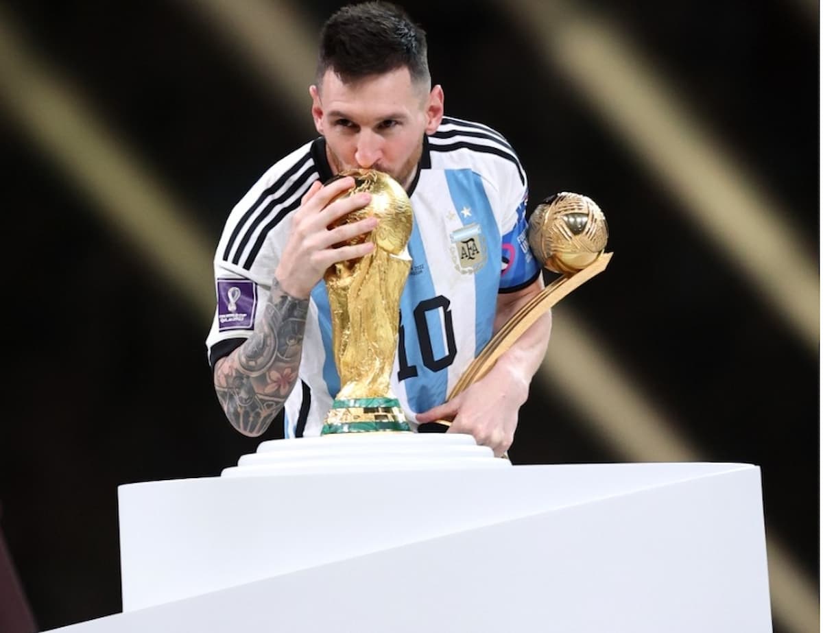 Lusail:Argentina's Lionel Messi celebrates with the trophy after winning the World Cup final soccer 