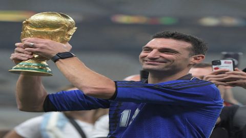 Lusail:Argentina's head coach Lionel Scaloni holds up the trophy after winning the World Cup final s