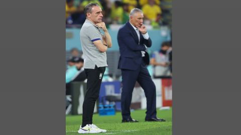 Doha :Coaches Paulo Bento (L) of South Korea and Tite of Brazil watch their teams' last 16 match at 