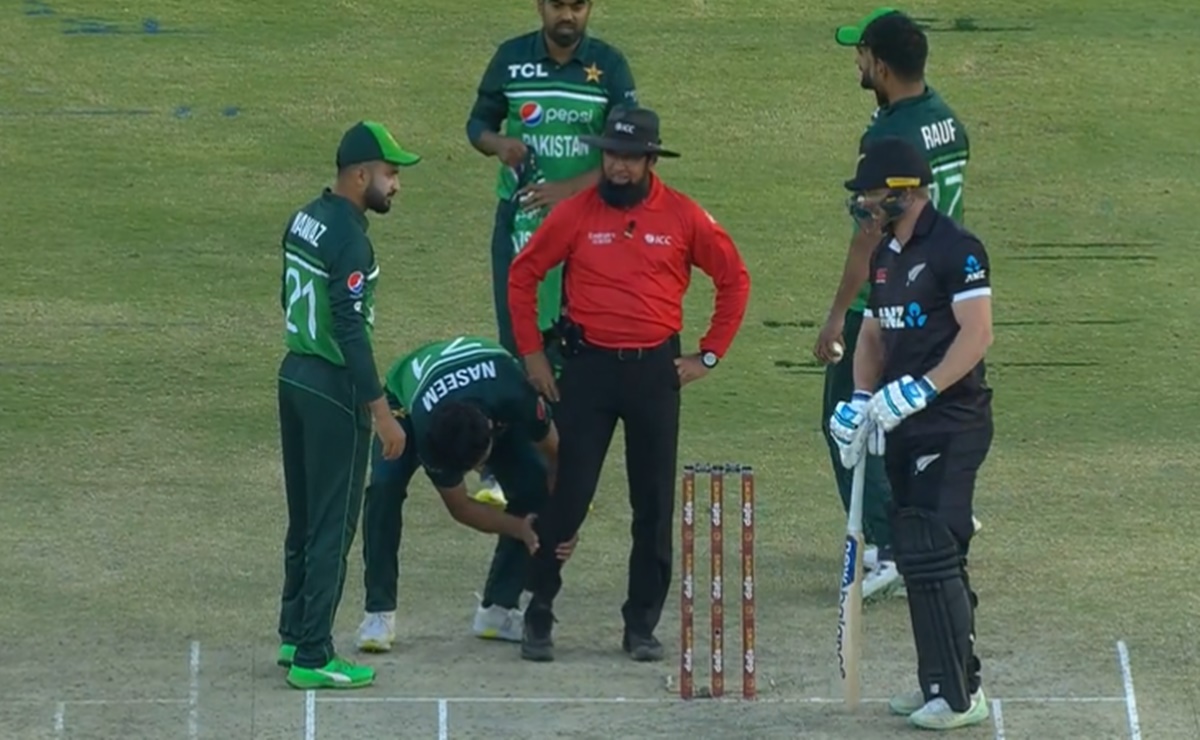 Cricket Image for Pak Vs Nz Umpire Aleem Dar Throws Haris Rauf Sweater