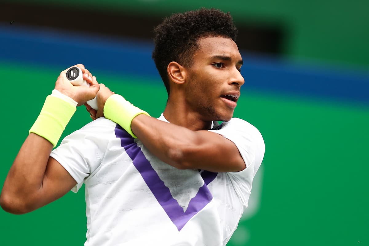 Felix Auger-Aliassime of Canada hits a return during the men's Felix Auger-Aliassime of Canada hits a return during the men's