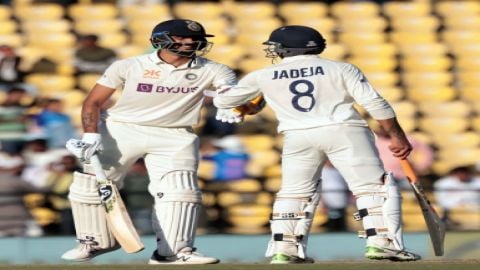 Nagpur:Ravindra Jadeja, right, congratulate teammate Axar Patel after scoring a boundary during the 