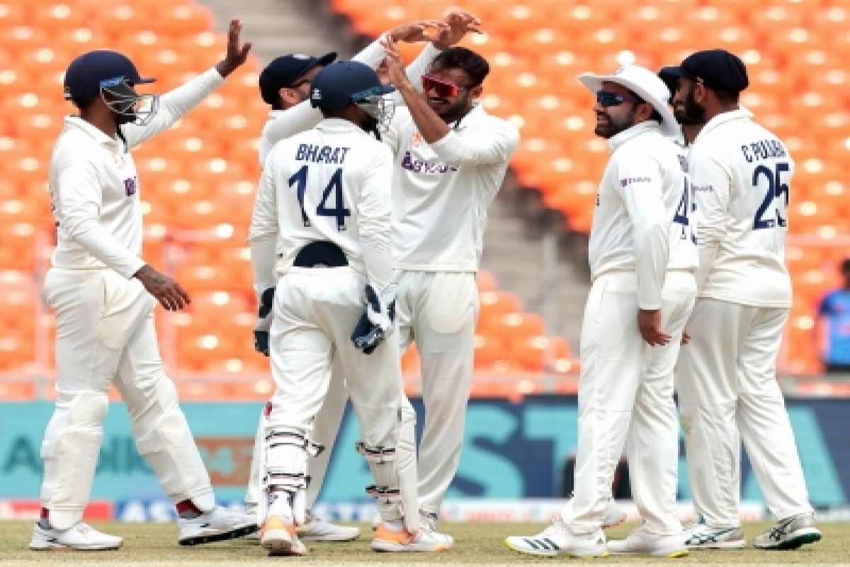 Ahmedabad : India's Axar Patel celebrates with teammate the dismissal of Australia's Travis Head dur