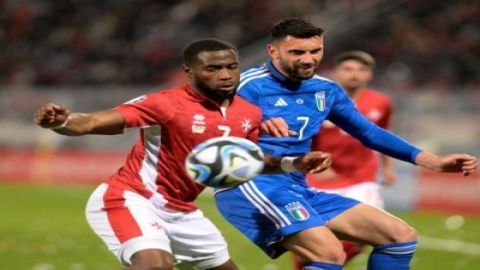 Malta's Cain Attard (front L) vies with Italy's Mateo Retegui during the 2024 UEFA European Champion