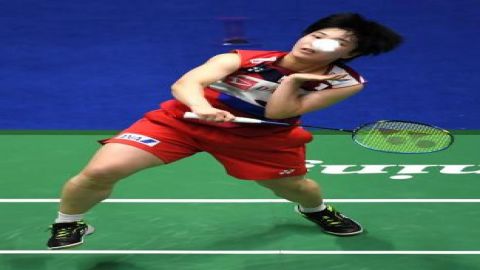 Akane Yamaguchi of Japan competes during women's singles match aga