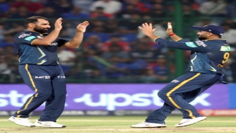 New Delhi: GT bowler Mohammed Shami with his teammate Rahul Tewatia celebrate the dismissal of DC's 