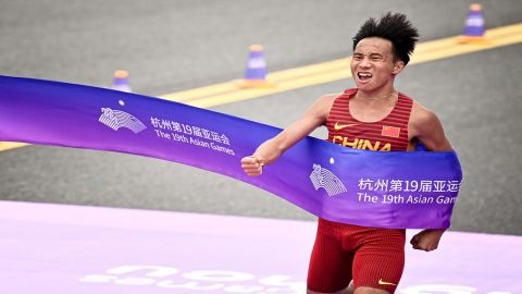 He Jie breaks new ground for China in men's marathon as the hosts retain women's basketball title