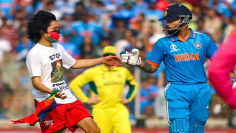 Pitch invader wearing Free Palestine t shirt hugs Virat Kohli During Final