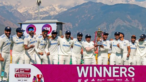 Dharamshala : Indian cricket team palyers pose with the winning trophy after they won the fifth test