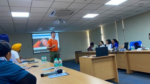 Herman Kruis conducts a workshop on modern techniques for leading hockey academy coaches