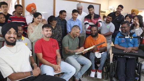 Punjab Kings players interact with patients with spinal injuries