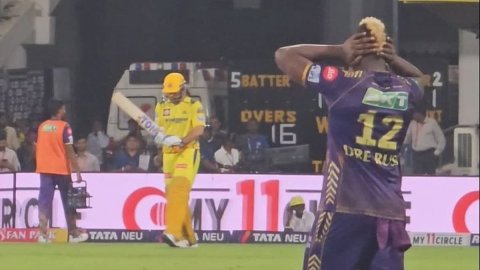 Andre Russell covers his ears as fans cause deafening noise upon MS Dhoni's entry