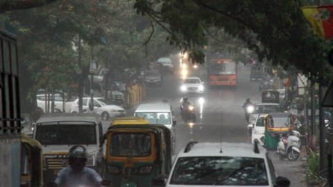 Bengaluru: Vehicles ply on the road amid rain in Bengaluru