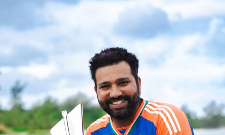 India's captain Rohit Sharma poses for photo with the winners' trophy after India won the ICC Men's 
