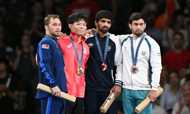 Paris : India's Aman Sehrawat poses with his bronze medal during the medal ceremony for men's freest