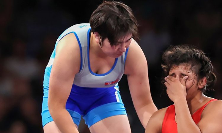 Paris: India's Nisha Dahiya reacts to an injury as she competes against North Korea's Sol Gum Pak du