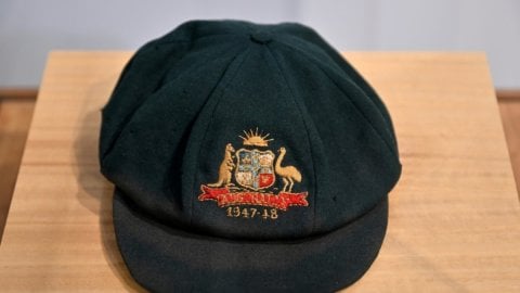 Don Bradman’s iconic 'Baggy Green' cap fetches Rs 2.63 crore in cricket memorabilia auction.