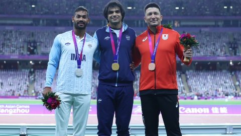 Hangzhou: Gold medalist Indian athlete Neeraj Chopra with silver medalist compatriot Kishore Kumar J