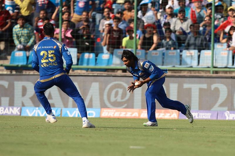 Mumbai Indians players celebrate fall of a wicket