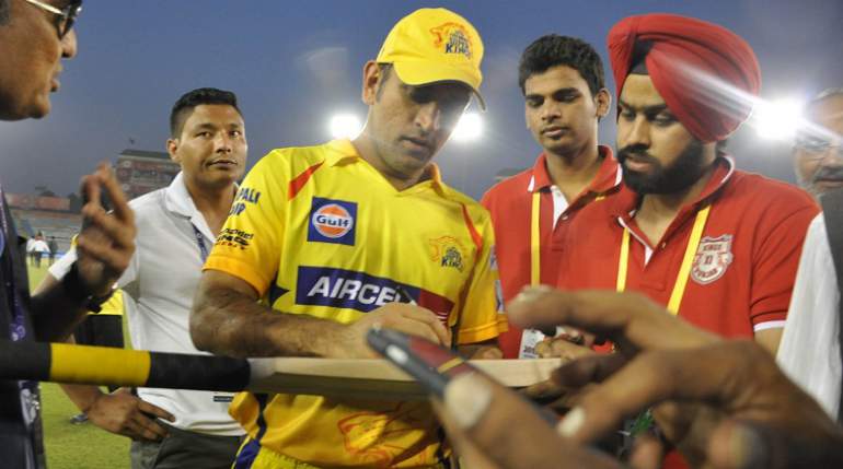 MS Dhoni signs autographs for fans