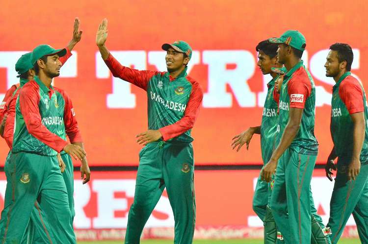 Bangladesh players celebrate fall of a wicket 