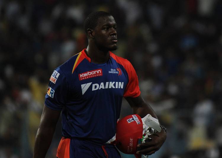 Carlos Brathwaite of Delhi Daredevils walks back to the pavilion in Tamil