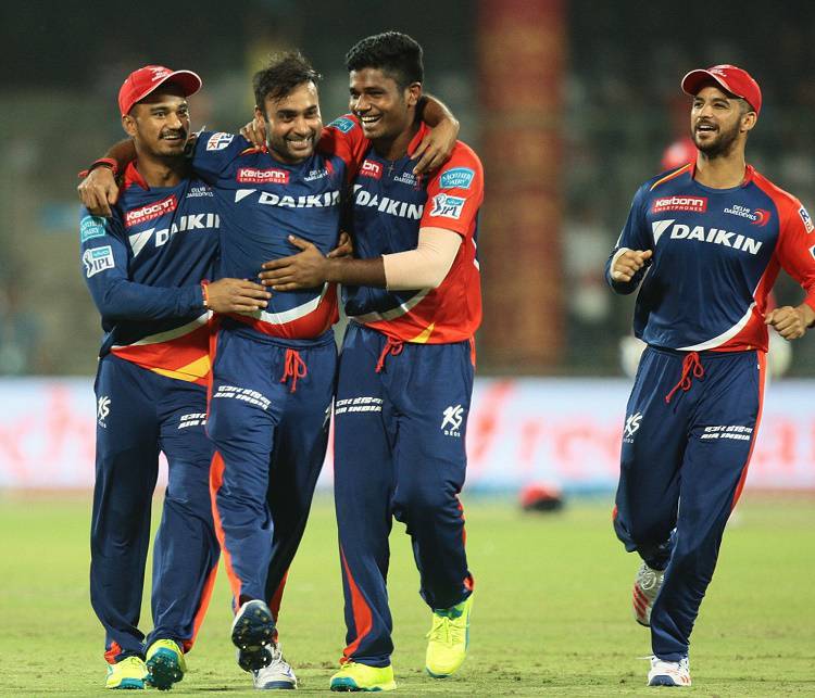 Delhi Daredevils players celebrate fall of a wicket in Tamil