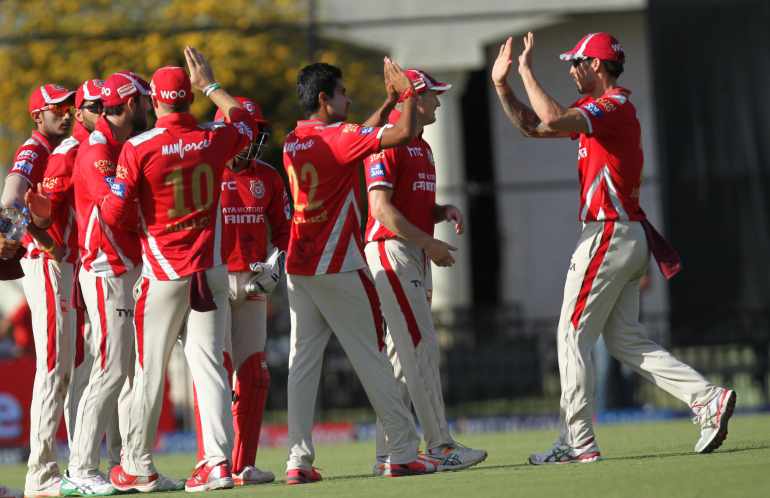 Kings XI Punjab celebrate fall of a wicket 