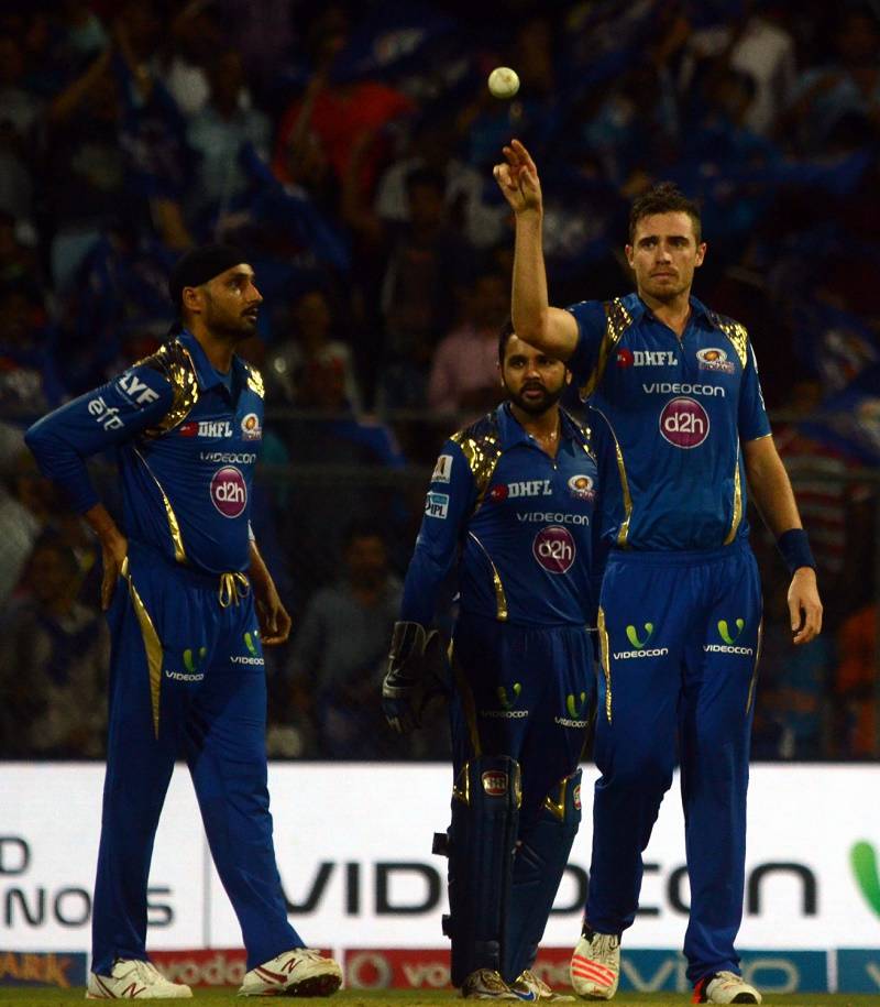 Mumbai Indians celebrate fall of a wicket  in Tamil