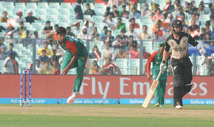 Bangladesh bowler Mustafizur Rahman celebrates fall of a wicket in Tamil