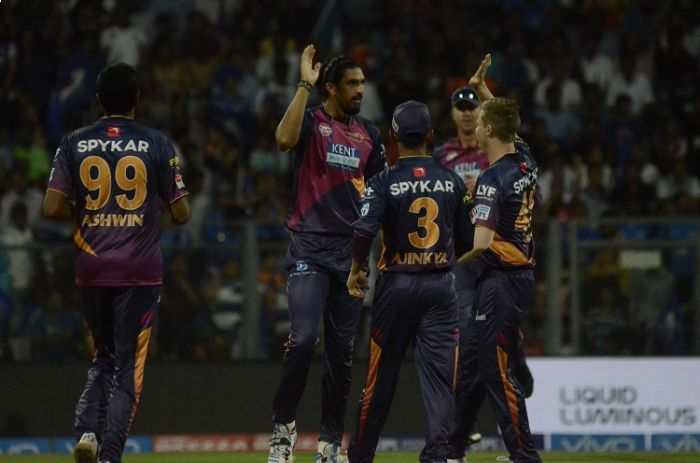 Rising Pune Supergiants players celebrate fall of a wicket in Tamil