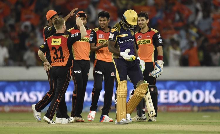 Sunrisers Hyderabad players celebrate fall of a wicket  in Tamil