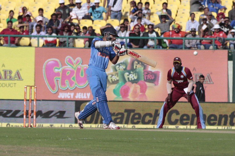 Indian cricketer Shikhar Dhawan in action at Dharmasala Stadium. in Tamil