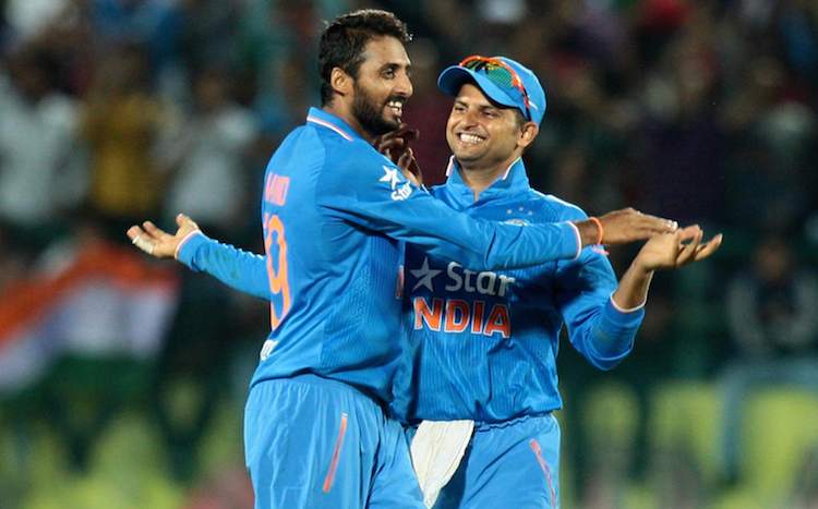 Sreenath Aravind and Suresh Raina celebrate fall of a wicket