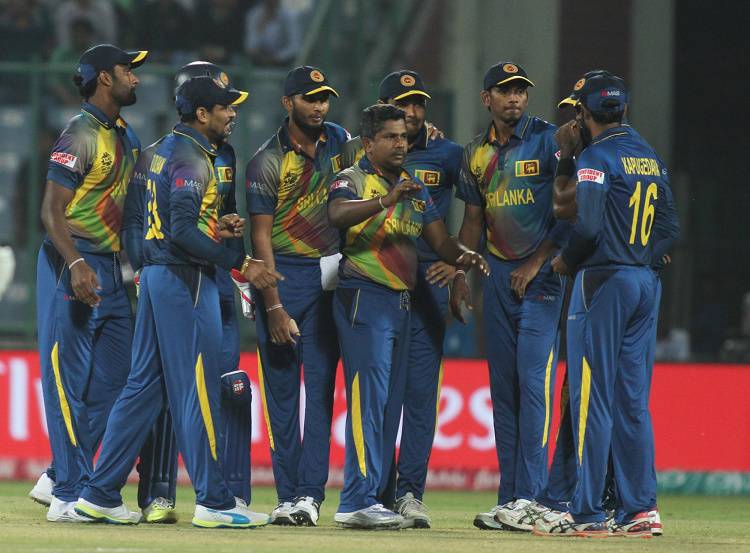  Sri Lankan players celebrate fall of Alex Hales wicket in Tamil