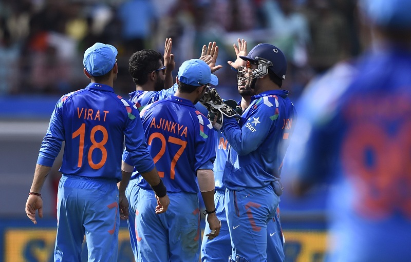 Indian cricketers celebrate fall of a wicket