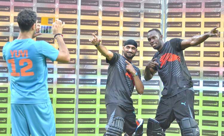 HD Image for cricket Usain Bolt, Yuvraj Singh and Harbhajan Singh during an exhibition match