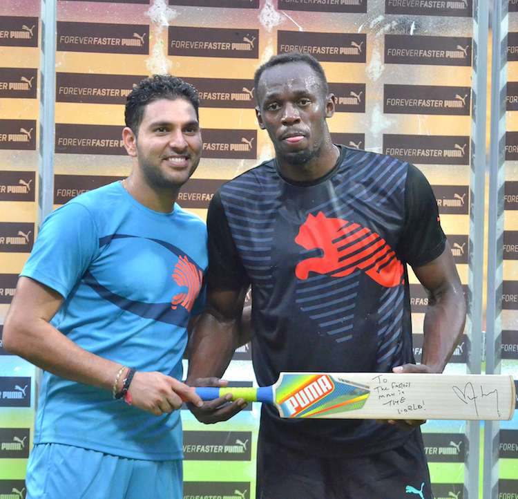 HD Image for cricket Usain Bolt and Yuvraj Singh During an Exhibition Match