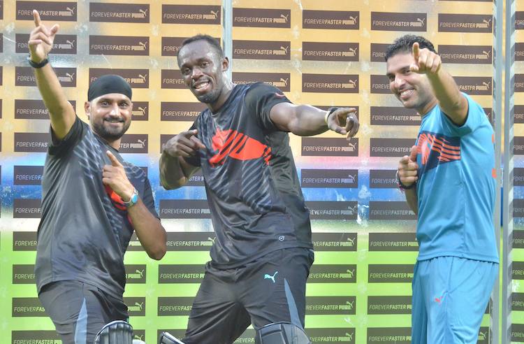 HD Image for cricket Usain Bolt, Yuvraj Singh and Harbhajan Singh during an exhibition match