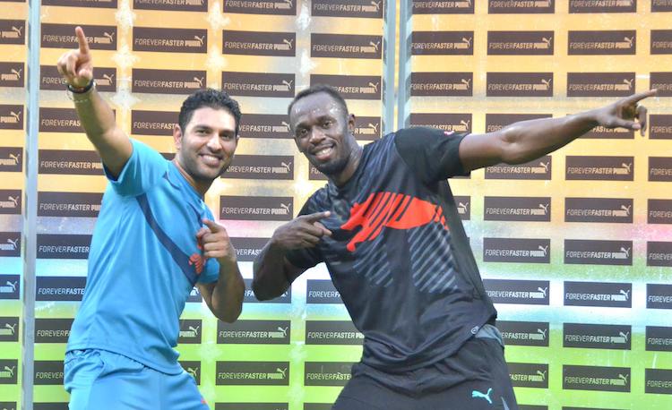 HD Image for cricket Usain Bolt and Yuvraj Singh during an exhibition match