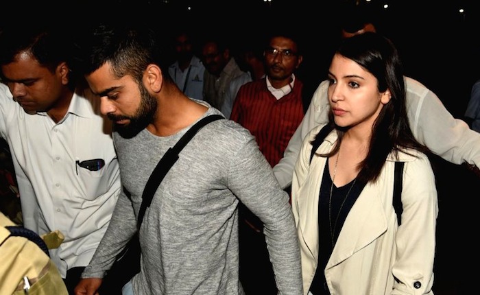 Hd Image for Cricket Virat Kohli with Anushka Sharma at Mumbai Airport in Hindi