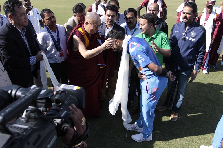 Indian cricketer Virat Kohli with Dalai Lama in Tamil