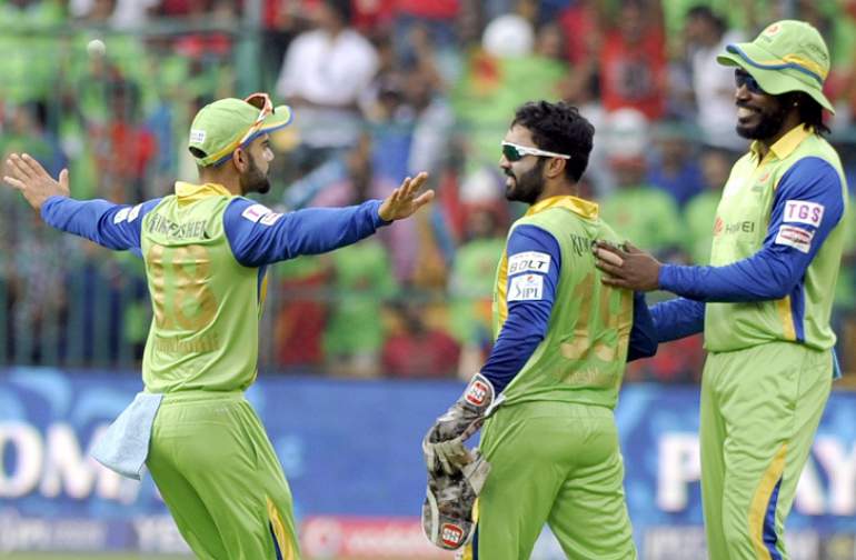 RCB players celebrate fall of a wicket